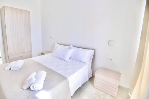 Ένα ή περισσότερα κρεβάτια σε δωμάτιο στο Casa Vacanza Boa Gialla Torre Guaceto