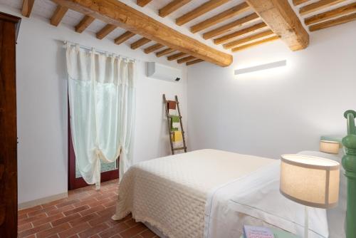 Ένα ή περισσότερα κρεβάτια σε δωμάτιο στο Villa Marielena Chianti hills view by Bestofmas