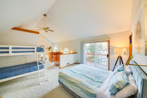 a bedroom with a bunk bed and a window at Fish and Bike Lake Pend Oreille Gem with Hot Tub! in Athol