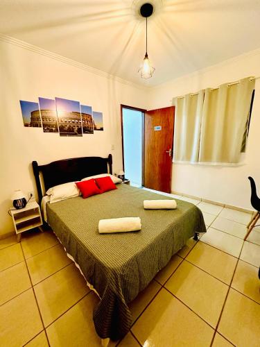 a bedroom with a bed with two towels on it at LAquolina in Socorro