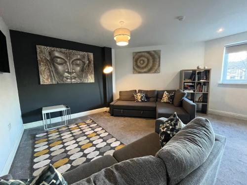 a living room with a couch and a table at Mia's Place 24 in Chester