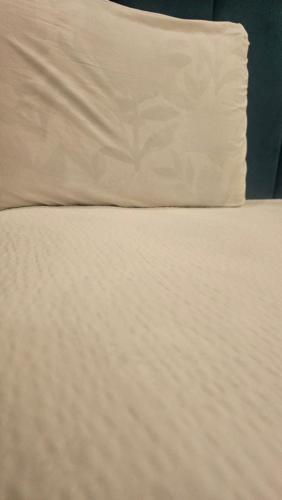 Hotel Expo View tesisinde bir odada yatak veya yataklar