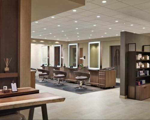 a hair salon with barber chairs and mirrors at Nobu Hotel Atlanta in Atlanta