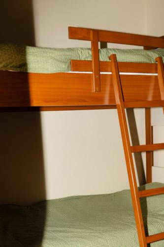 a ladder on top of a bunk bed at Le Cedrus Hotel in Al Arz