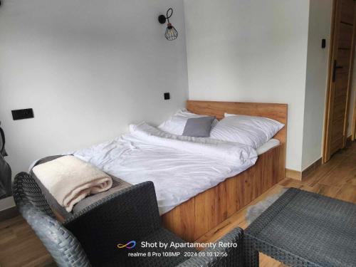 Ein Bett oder Betten in einem Zimmer der Unterkunft Apartamenty RETRO FV