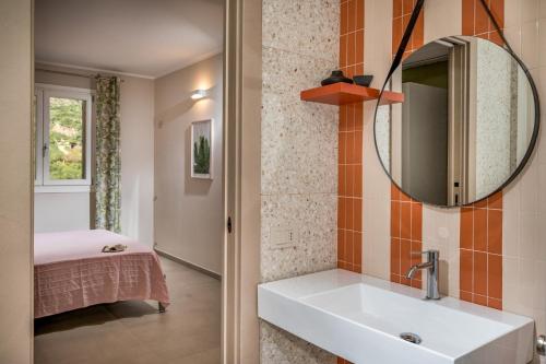 a bathroom with a sink and a mirror at Villa Orizzonte in Scopello