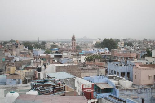 a view of a city with blue buildings at Yogis Guest House in Jodhpur