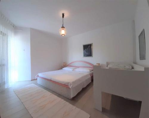 Postel nebo postele na pokoji v ubytování Family Apartments Cherry