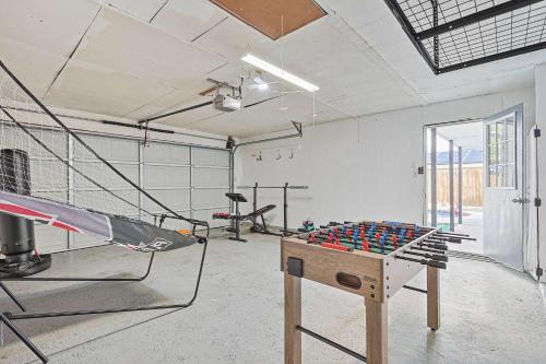 a gym with a foosball table in a room at Charming 3Bd 2Ba Home with Private Pool in The Colony