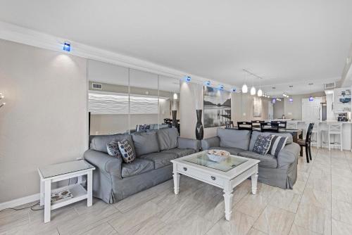 a living room with a couch and a table at 317 - Fantastic 3 BR Oceanfront Corner in Edgewater