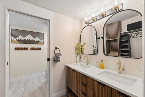 a bathroom with a sink and a mirror at Ski-In/Out Mountain Bunker: Luxury Studio Sleeps 6 in Park City