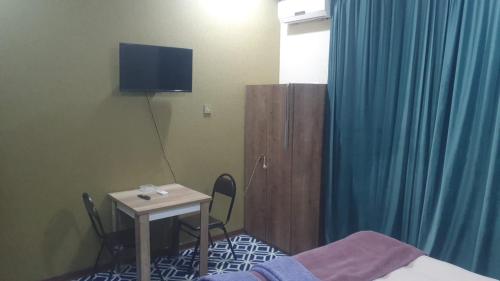 TV a/nebo společenská místnost v ubytování Ekm Hotel