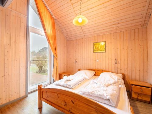 Katil atau katil-katil dalam bilik di ideales Ferienhaus für Familien