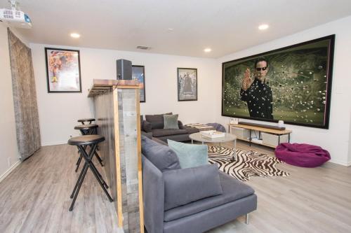 a living room with a tv and a couch at Big Family House w Theater Pool table in San Antonio