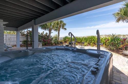 a hot tub in the backyard of a house at Oceanfront Beauty in Saint Augustine