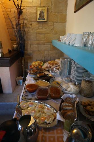 a table with many different types of food on it at ''EPAVLIS boutique GALAXIDI'' in Galaxidhion