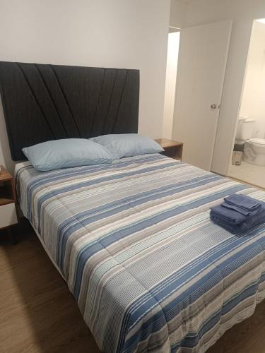 Postel nebo postele na pokoji v ubytování Rosita del Mar