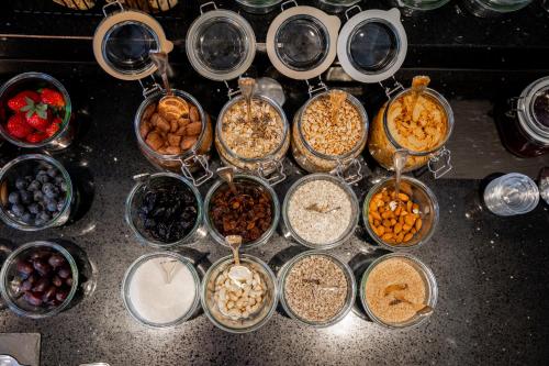 a bunch of bowls of food on a counter at Hotel Maria Theresia in Mayrhofen