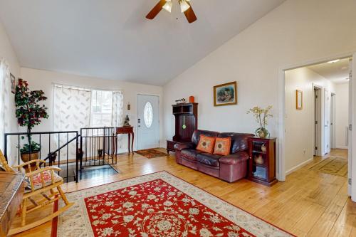 a living room with a couch and a table at Quiet Cove in Dandridge