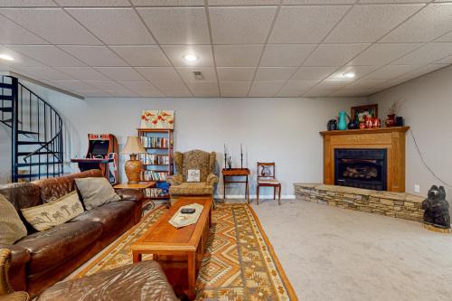 a living room with a couch and a fireplace at Quiet Cove in Dandridge