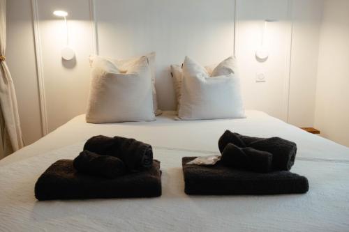 Ένα ή περισσότερα κρεβάτια σε δωμάτιο στο 20mètres Plage - Maison -Jacuzzi - Wifi - Terrasse