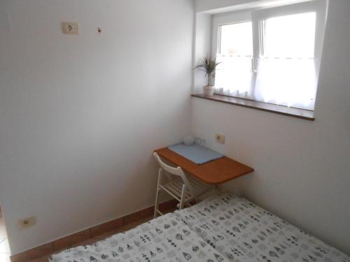 a small room with a desk and a window at Love 2 Solkan in Nova Gorica