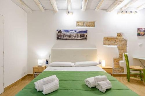 Postel nebo postele na pokoji v ubytování Talia Capo Massimo