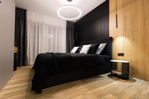 Katil atau katil-katil dalam bilik di Royalton Suites
