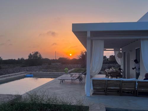 a view of a sunset from the patio of a house at Dimora Vereto in Morciano di Leuca