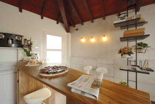 a kitchen with a counter with a cake on it at La Corte sul Naviglio in Boffalora sopra Ticino