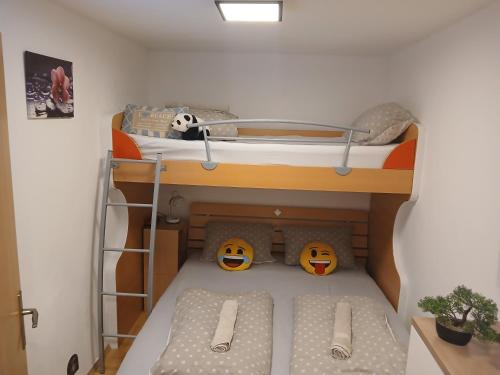 a toy bunk bed in a doll house at Aqualuna Petrov brlog in Podčetrtek