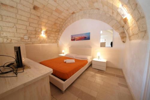 En eller flere senge i et værelse på Il Porto Di Ciccia'