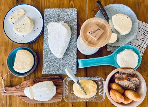 a table topped with different types of bread and other foods at Zagroda na Pacanach in Iwkowa