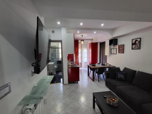 a living room with a couch and a table at Flawer Flat x4 in Turin