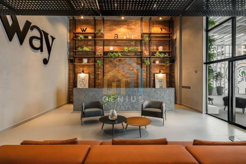a lobby with a couch and chairs and a table at Way Tambaú próximo ao Letreiro João Pessoa - Genius Flats in João Pessoa
