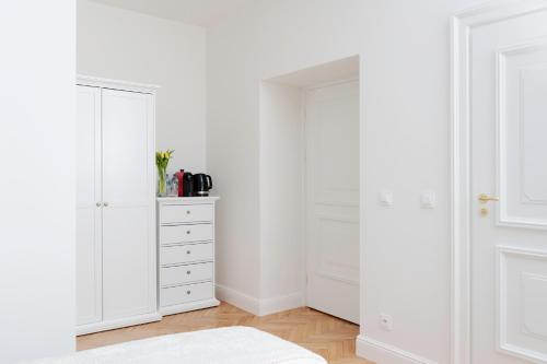 Voodi või voodid majutusasutuse Domus Carmeli Chic Appartments Powiśle toas