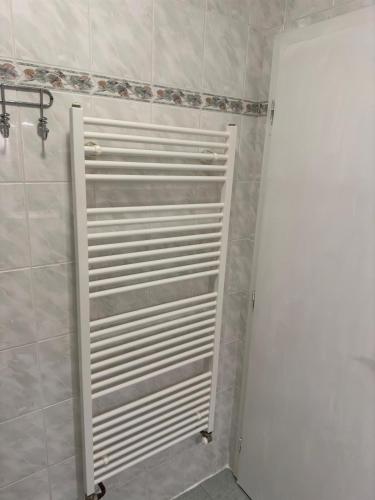a bathroom with a white radiator in a room at Slunečná Lada in Borová Lada