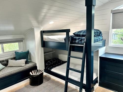 a bedroom with bunk beds in a tiny house at Contemporary 4BR with Ski Run Views in Park City