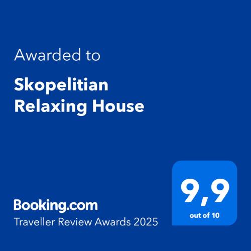 a blue sign with the text awarded to skypicismreliking house at Skopelitian Relaxing House in Skopelos Town