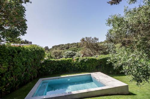 a swimming pool in the yard of a house at Cascais Villa - private pool in Cascais