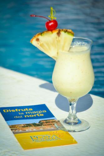 a drink with a margarita and a cherry on top at Bungalows Playa Bonita in Máncora