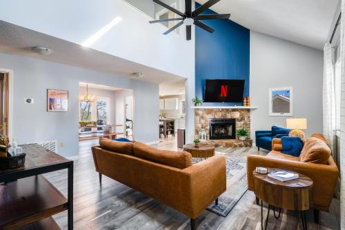 a living room with two couches and a fireplace at Mtn Views, Hot Tub, 2 Game Rms, Fire Pit, Pet Friendly, Top Mtn in McGaheysville