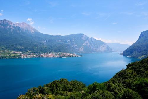 a view of a lake between two mountains at Stella Apartment on Lake Como in Onno