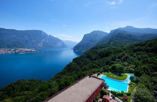 a view of a body of water with mountains at Stella Apartment on Lake Como in Onno