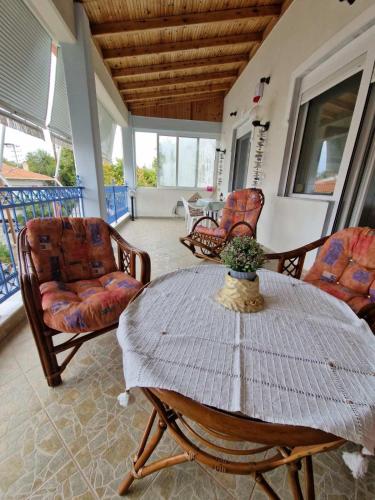 a living room with a table and chairs at Seaside Apartment in Vergia in Vergia