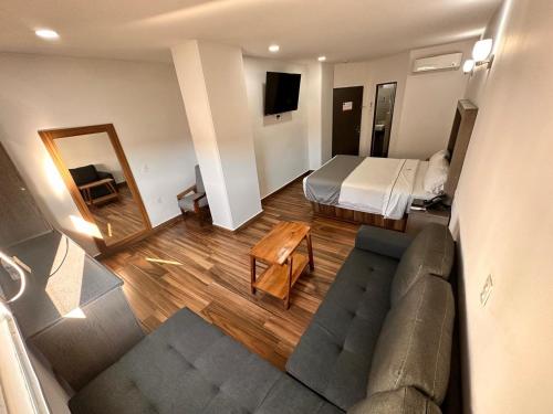 Postel nebo postele na pokoji v ubytování Hotel Bugari Aeropuerto Guadalajara