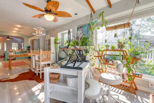 a room with a bunch of plants on the wall at Boho-Chic Retreat with Yard, 22 Mi to Dtwn Austin! in Kyle