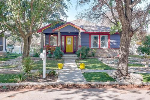 a red and blue house with a yellow door at Boho-Chic Retreat with Yard, 22 Mi to Dtwn Austin! in Kyle