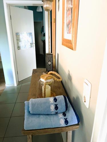 a table with a blue towel on top of it at Fewo am Strand in Koserow - Casa del Mar - 42m bis zum Strand in Ostseebad Koserow