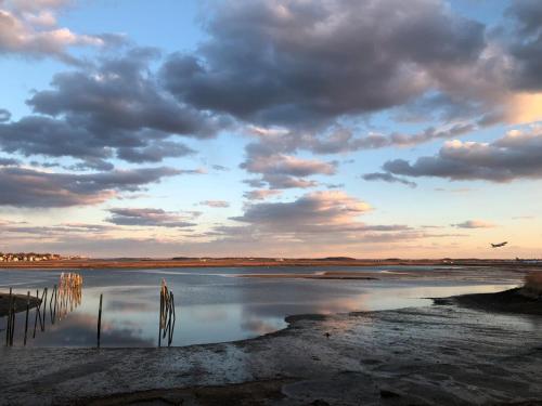 a view of a body of water with a cloudy sky at Waterfront Escape - Close to Airport & Downtown in Boston